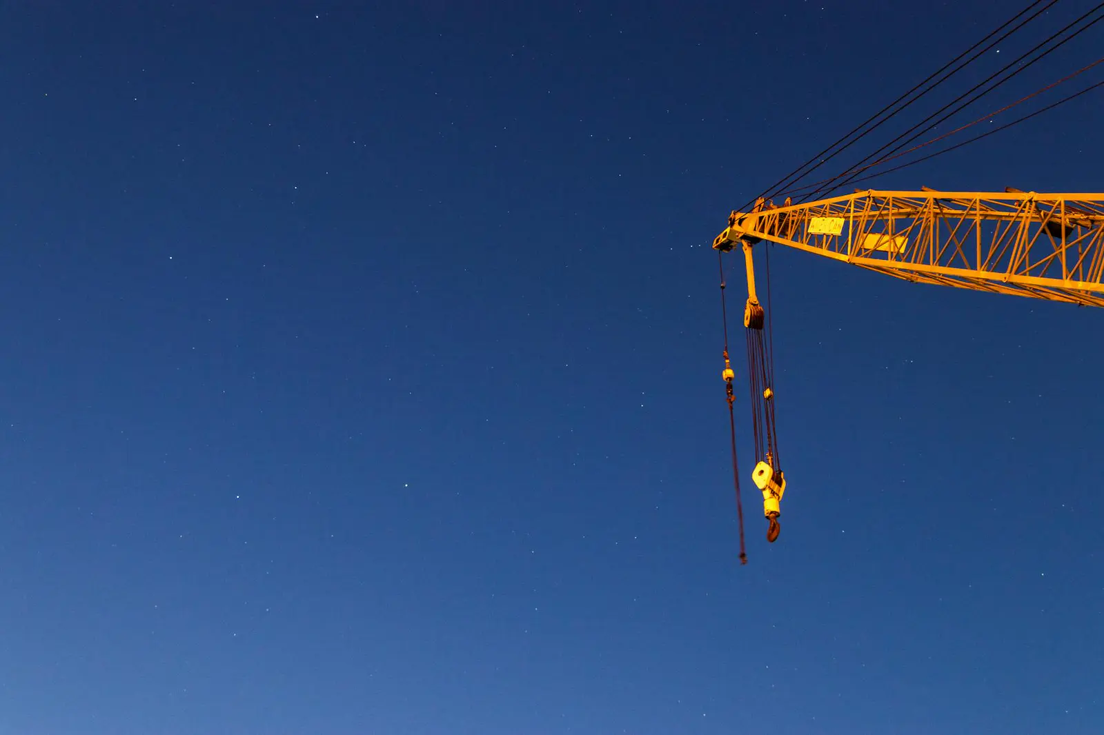 Construction crane attachments and rigging gear