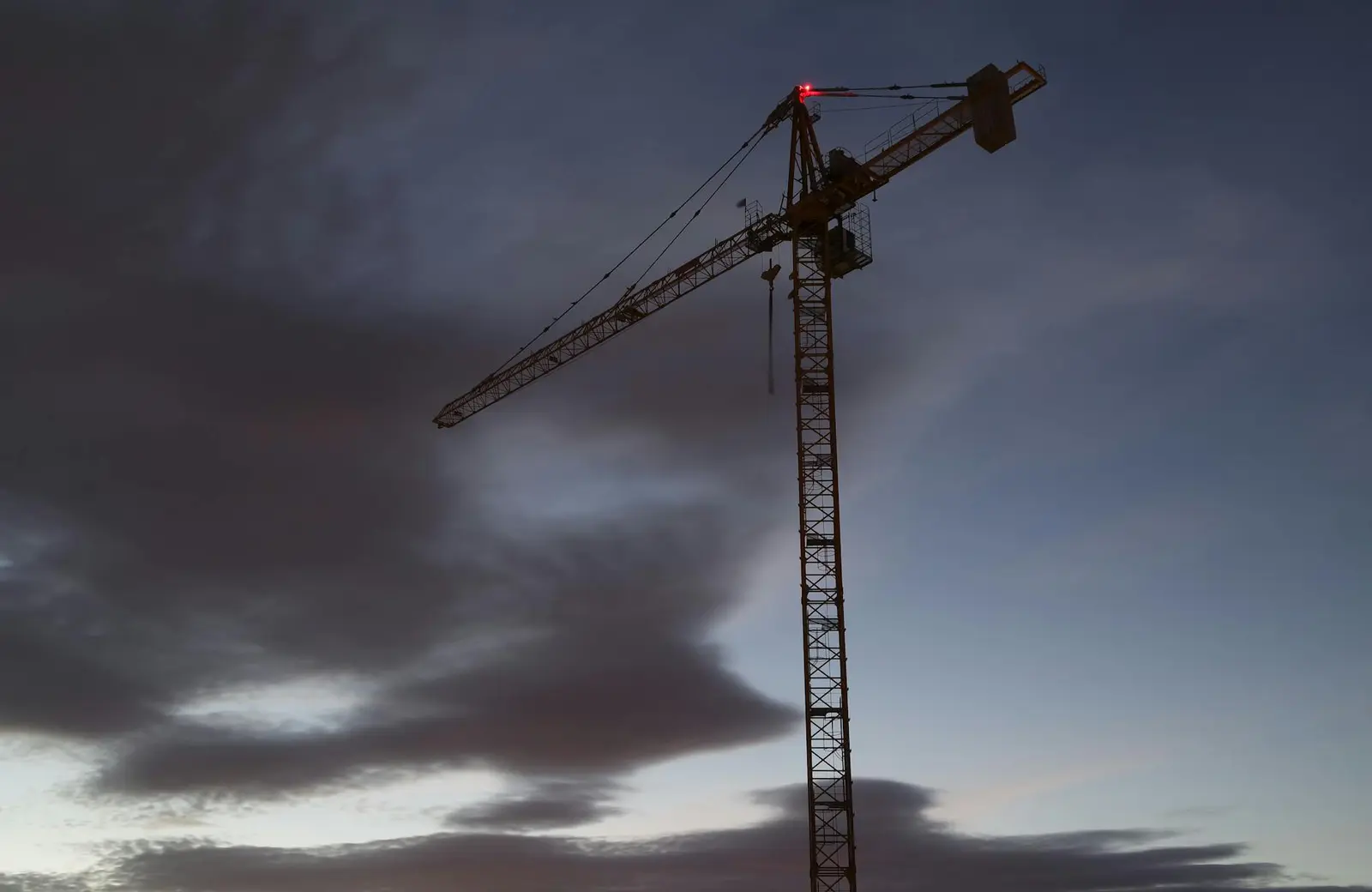 Large tower crane operating at a construction site