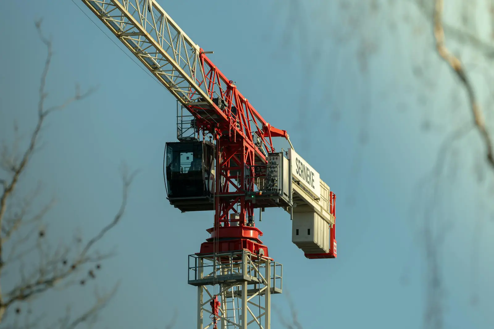 Large tower crane operating at a modern construction site